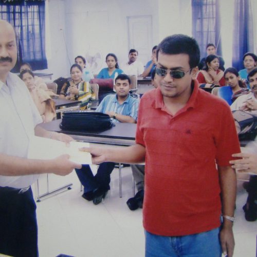 Prof. Ranjan Bhattacharya, giving certificate at OP